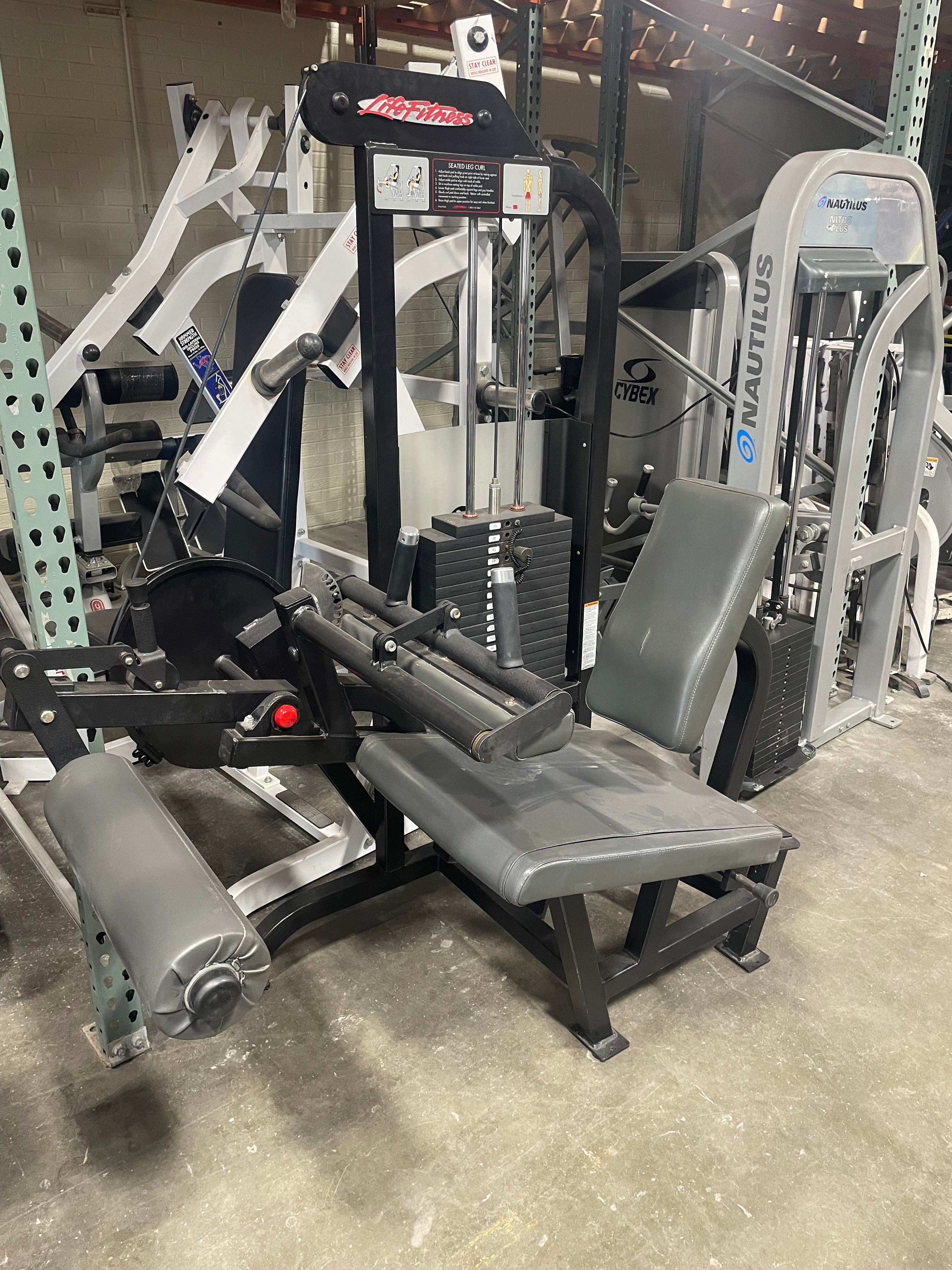 Life fitness hamstring online curl machine