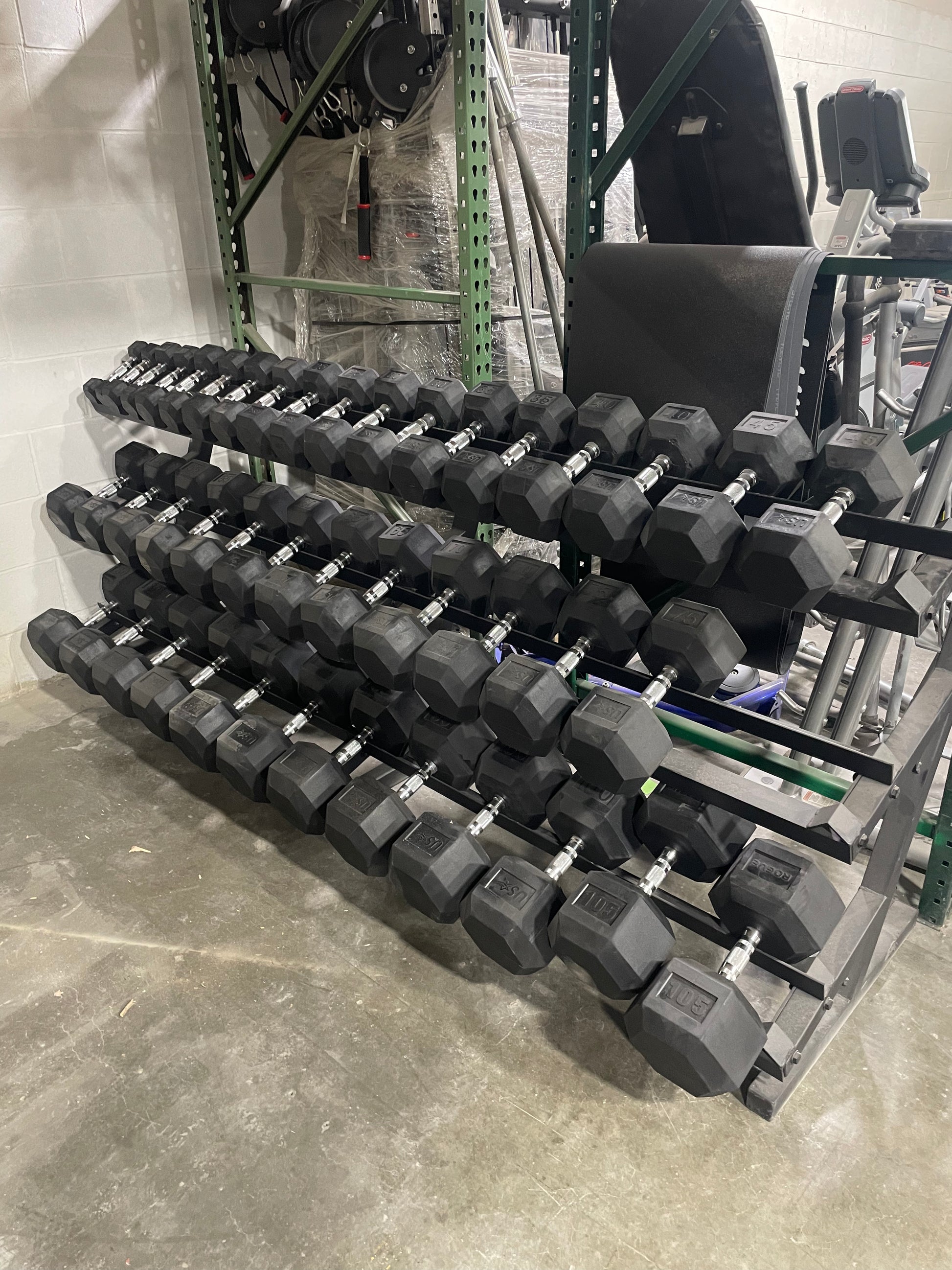 Troy with heavey ROGUE RUBBER HEX DUMBBELLS 5 125lbs w Rack Midwest Used Fitness Equipment